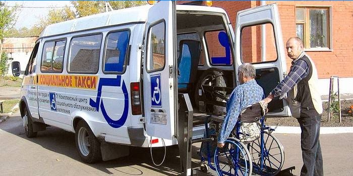 Disabled person boarding a social taxi