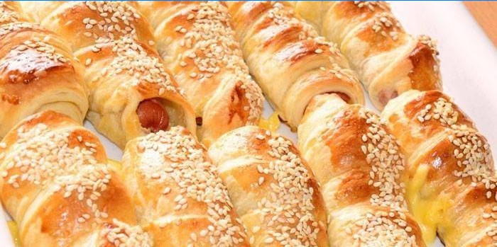 Baked sausages in sesame dough