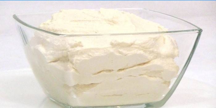 Homemade cream cheese in a glass bowl