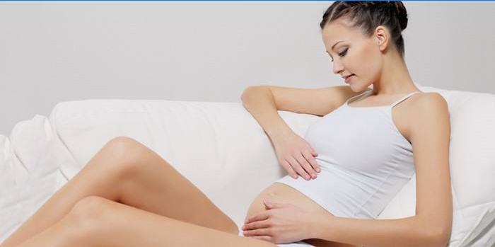 Pregnant woman stroking belly