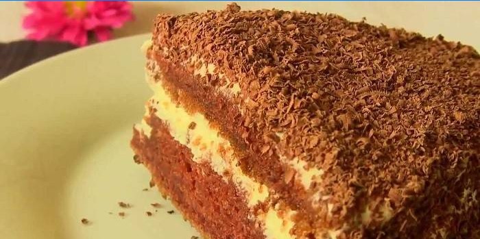 A slice of chocolate cake made from kefir cake and custard