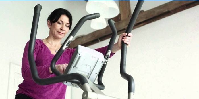 Woman sets exercise program on ellipsoid