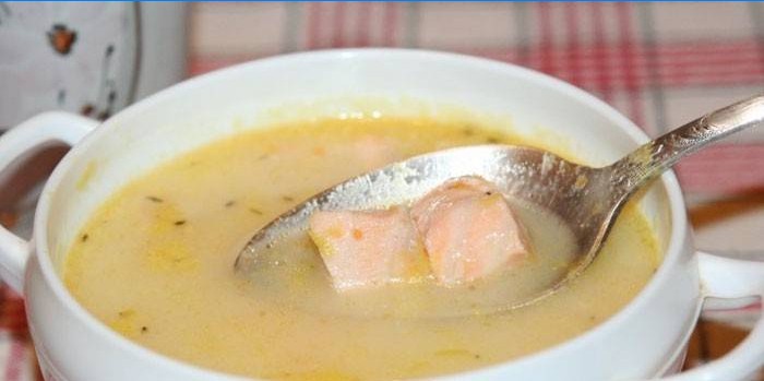 Fish soup with slices of salmon and cream