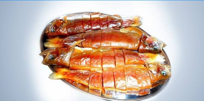 Four dried trout on a plate