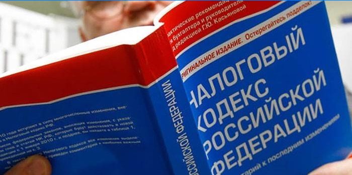 A man reads the tax code of the Russian Federation