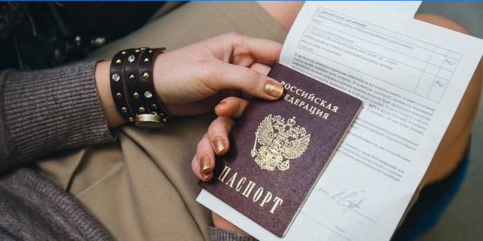 Passport and information in the hands of a girl