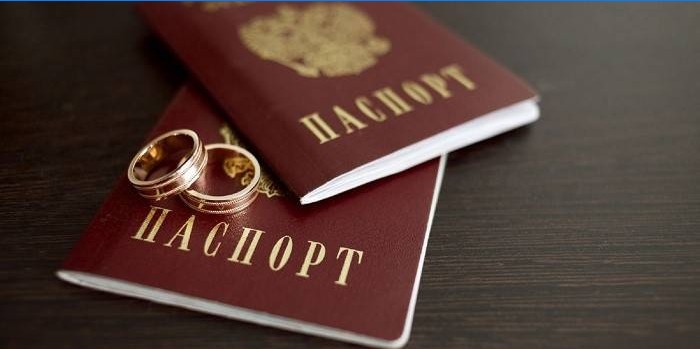 Two passports and wedding rings