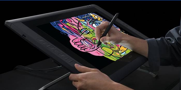 Man draws on a tablet