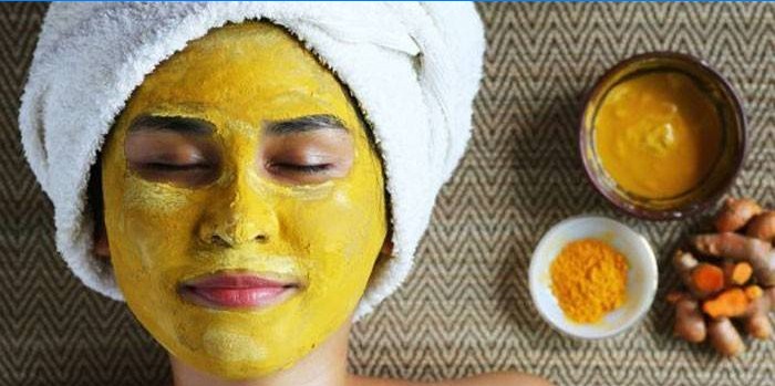 Mask with turmeric on the girl's face