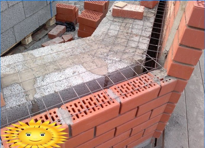 Facing a house made of expanded clay concrete blocks with bricks