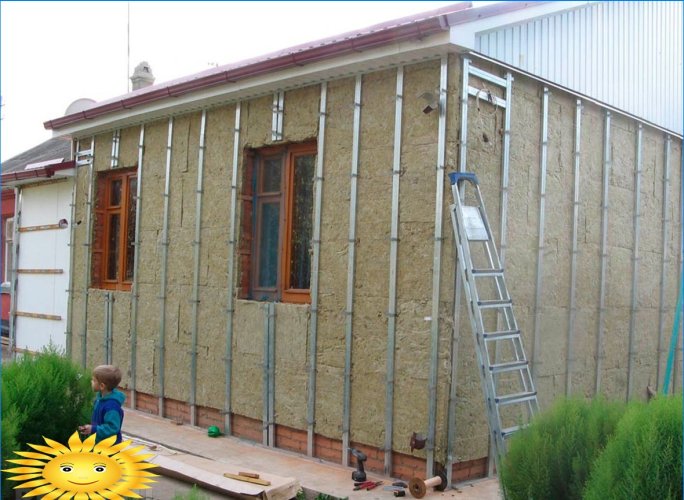 Decorating the house with metal siding under a beam or log