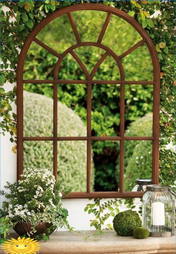 Mirror in the garden as an unusual detail of landscape design
