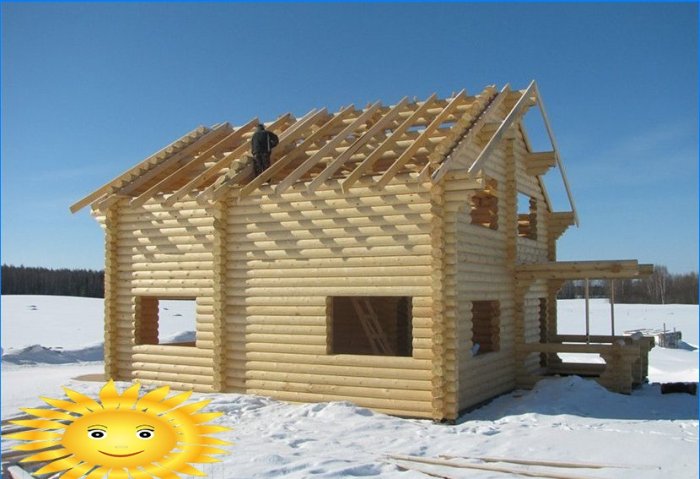 Construction of a wooden house in winter