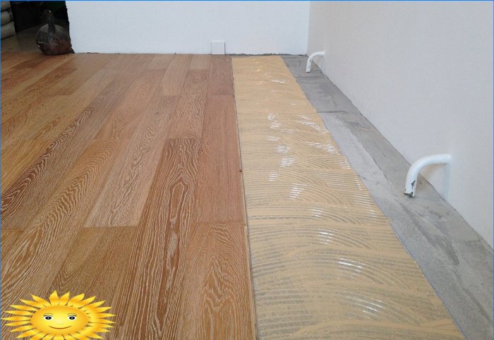 Laying the engineered board on a concrete floor with glue