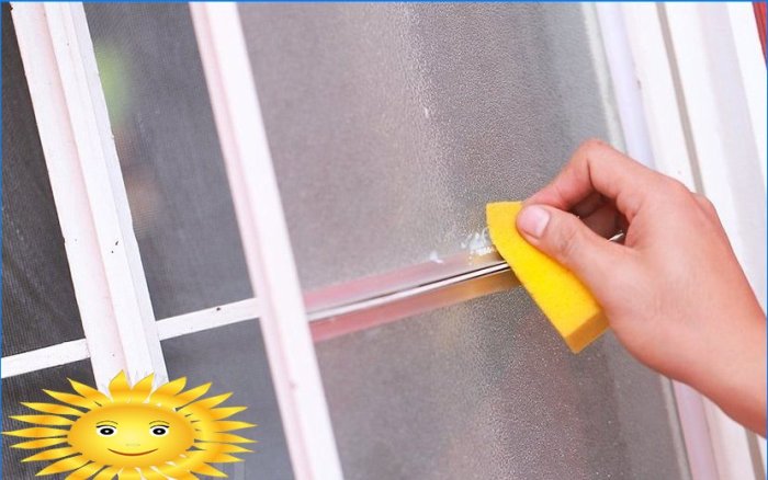 Removing adhesive tape from glass