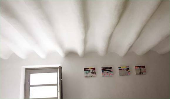 An uneven whitewashed ceiling