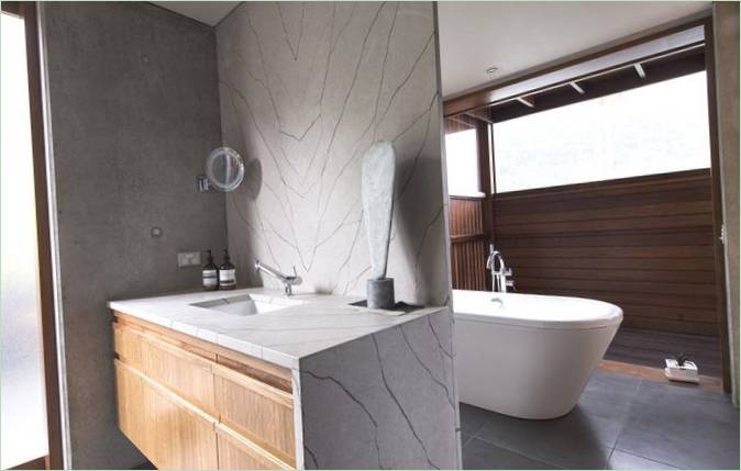 Bathroom interior with elements of stone and wood in the decoration