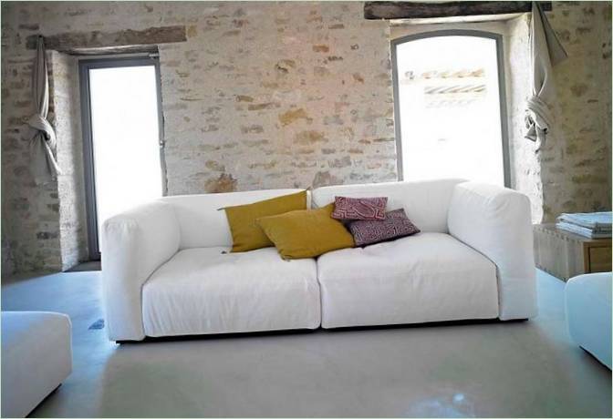 White upholstered furniture with colored cushions