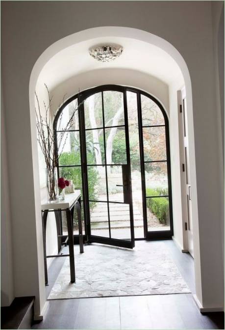 A glass front door in an archway