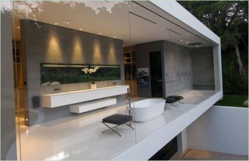 A spacious bathroom with glass walls