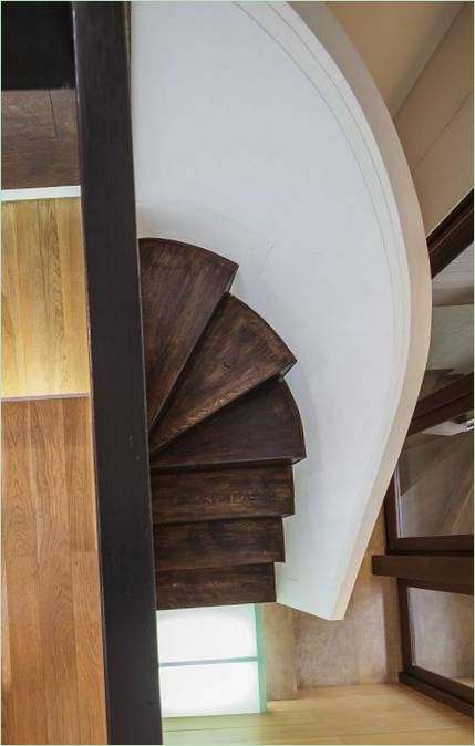 Spiral staircase in the interior of the house in the loft style