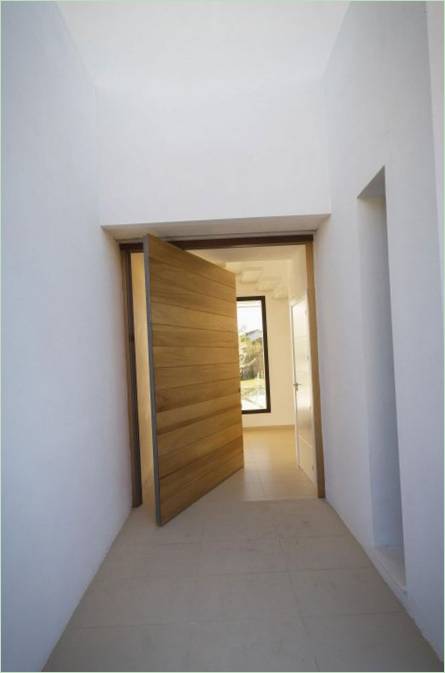 The front door of the snow-white Avilés-Ramos residence in Spain