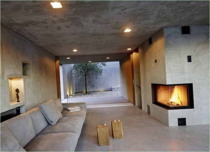 Lounge with fireplace and access to the patio