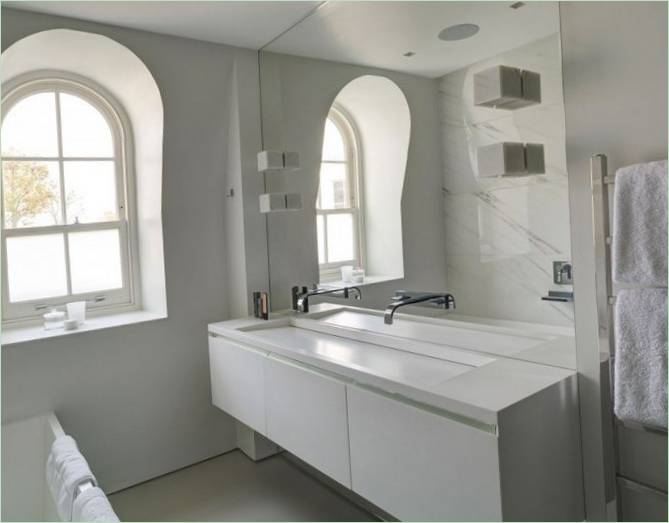 Arched window in the bathroom of a detached house on London's Maida Vale