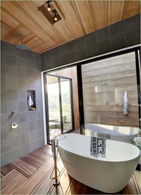 Bath and shower cubicle in one room