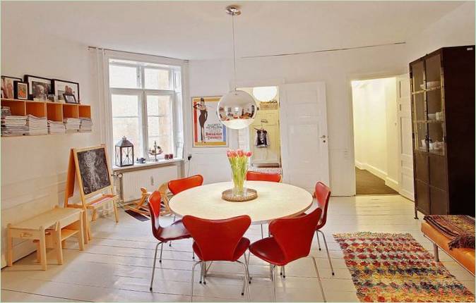 Scandinavian breakfast nook with colorful chairs