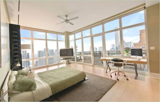 Design of a bedroom with floor-to-ceiling windows