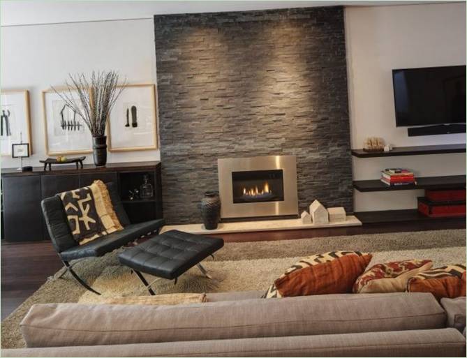 Interior design of the living room: a closed stone fireplace