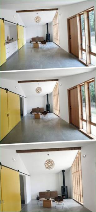 Bright yellow doors separating the kitchen from the living room in the house