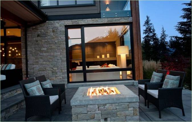 Terrace sitting area with a hearth
