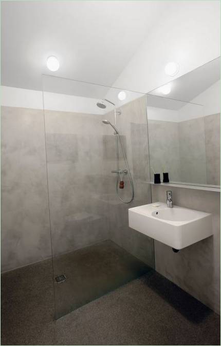 Grey and white interior of the bathroom after the renovation of the house