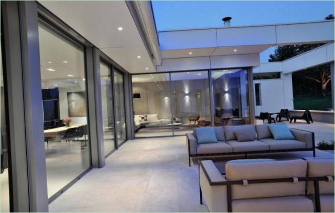 A beautiful view of the interior of the house through the glass doors-walls