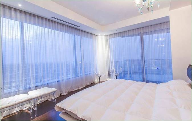Bedroom interior with panoramic windows