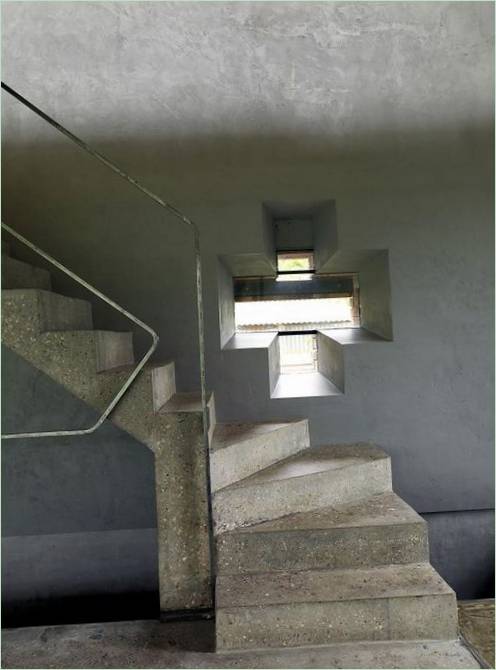 Gray concrete staircase to the second floor